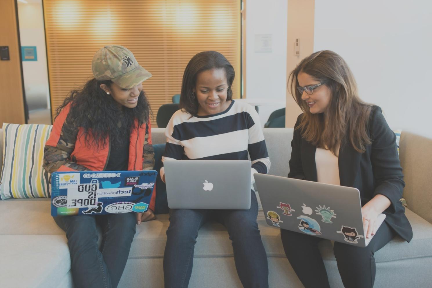 Modern workspace with cybersecurity professionals collaborating on financial security systems and threat analysis