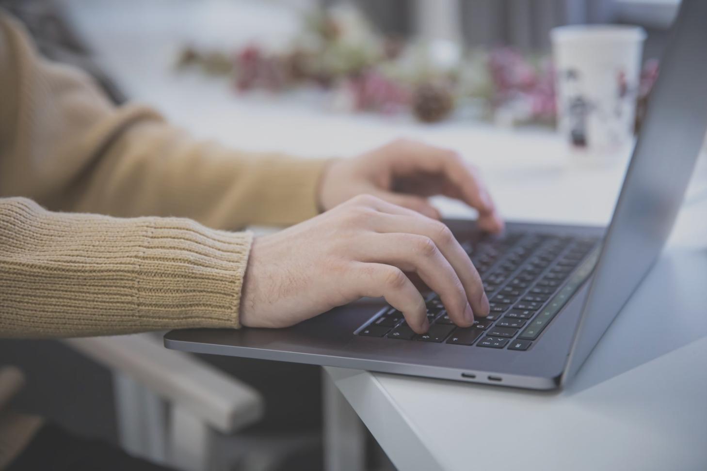 Security professional analyzing financial system vulnerabilities on multiple monitors